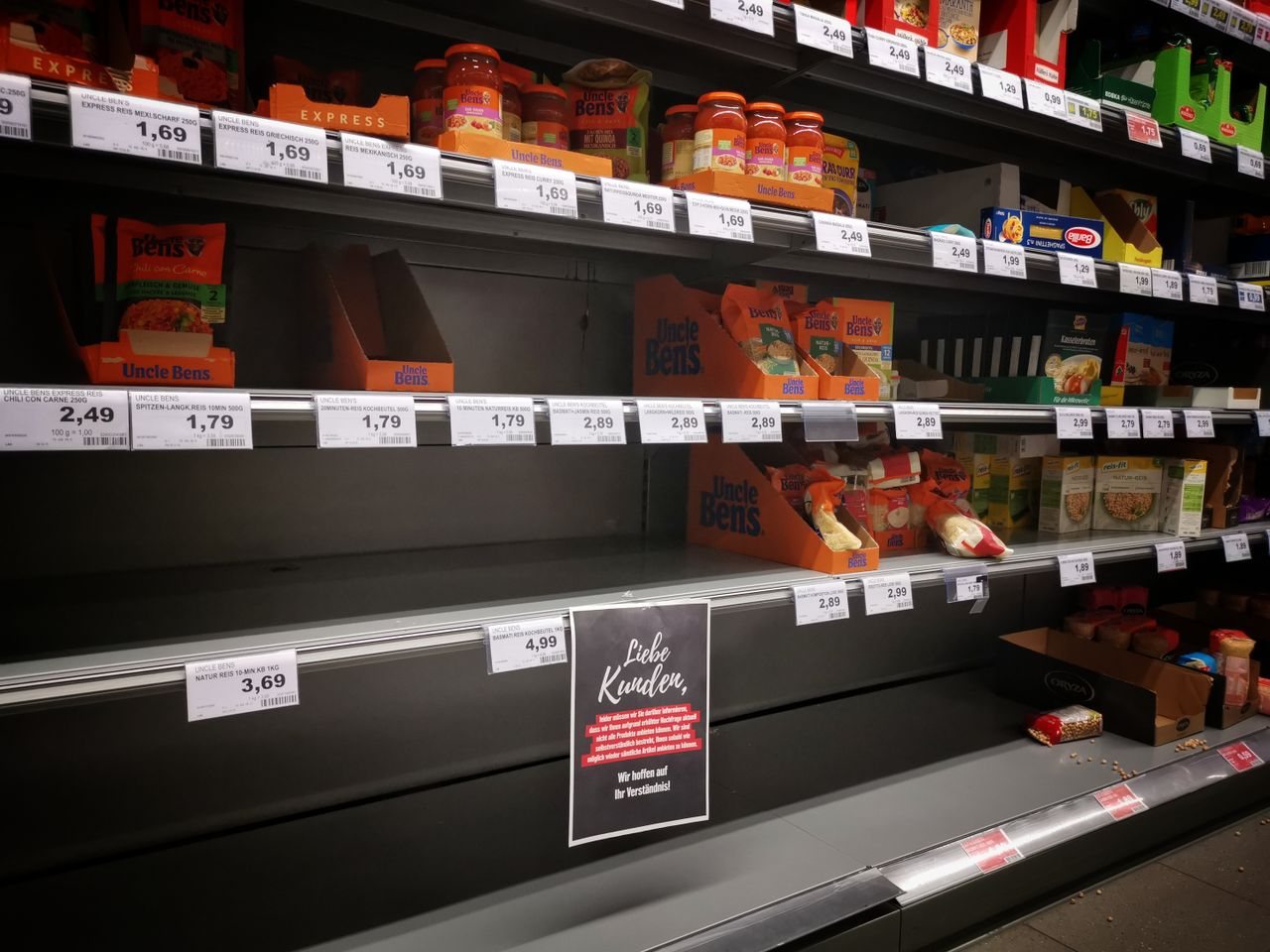 Free Half empty shelves with assorted products in jars and containers in supermarket during quarantine Stock Photo